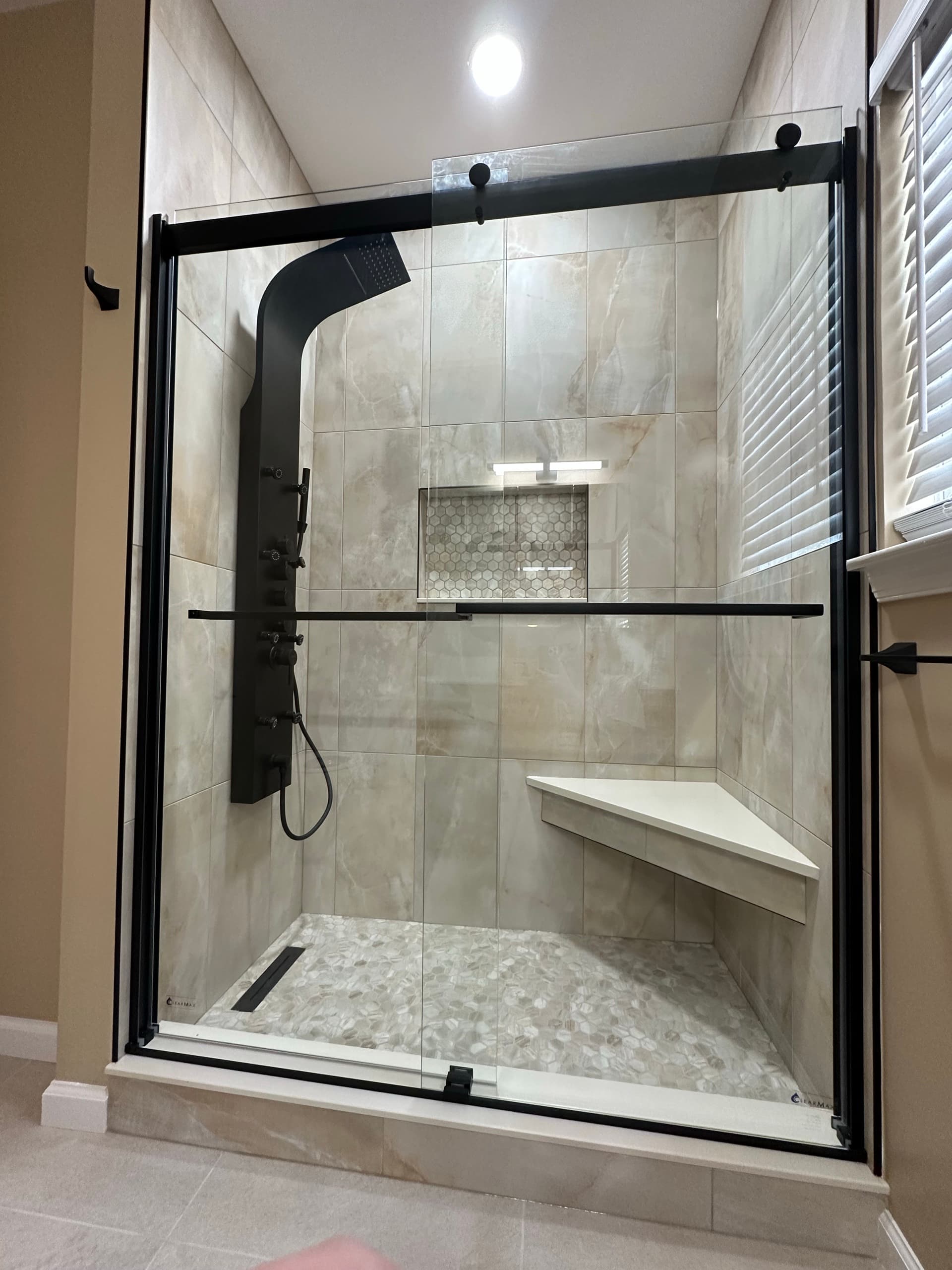 Primary bathroom remodel with walk-in shower by Modern Master, serving Warren, NJ
